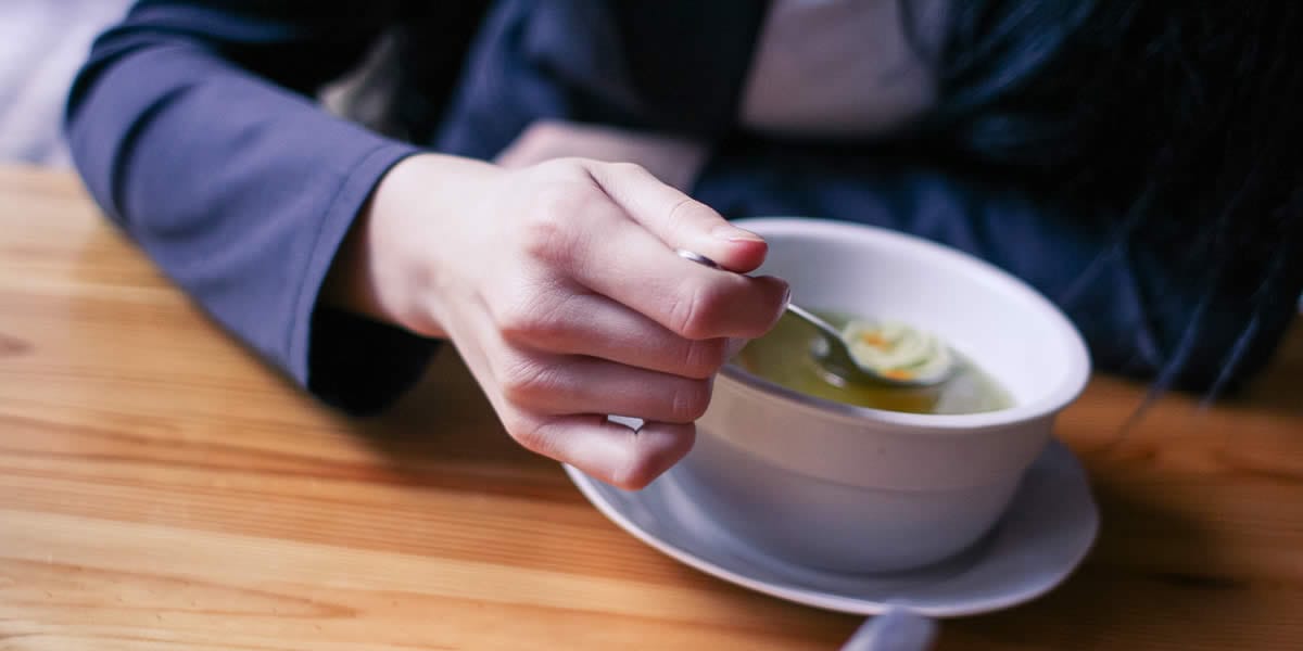 Bowls of hot soup served during the Souper Bowl Stroll food tour in downtown Naperville