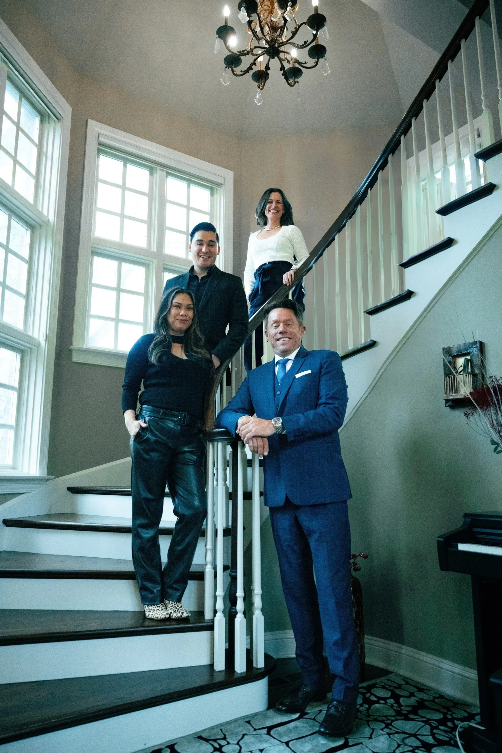 Naperville Homes for Sale 2 Professional real estate team standing on a staircase inside a bright Naperville home, representing Dan Firks Real Estate and its top Naperville real estate services.