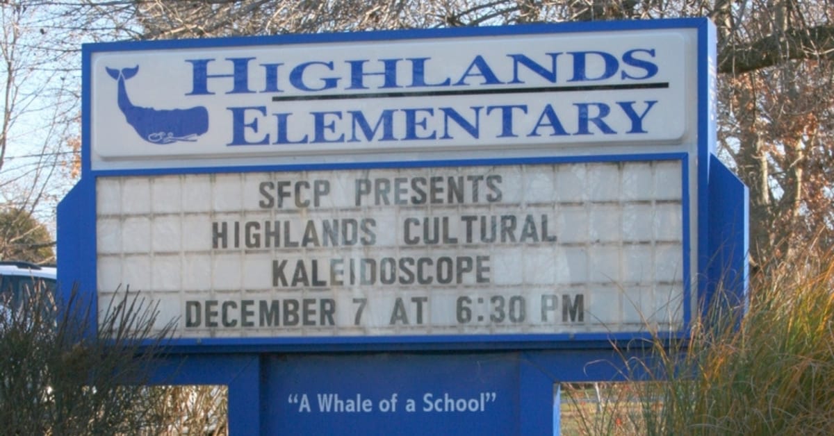Highlands Elementary School sign in Naperville featuring the whale mascot logo and event marquee.