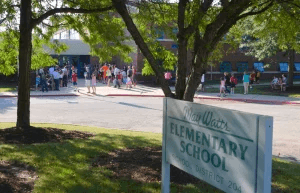 Exterior of May Watts Elementary School in Naperville, located near May Watts Park.