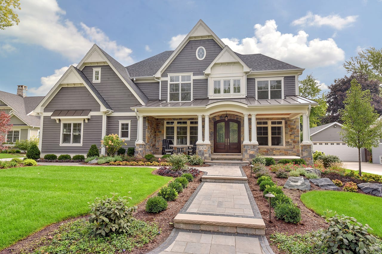 WordPress Media Library Inputs Alt Text Luxury custom home by Siena Custom Builders in Naperville, IL featuring gray siding, stone accents, and professional landscaping.