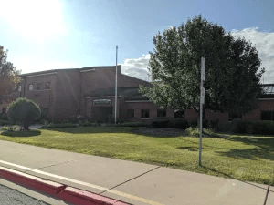 Exterior of Arlene Welch Elementary School in Naperville, featuring the red brick facade and school sign.