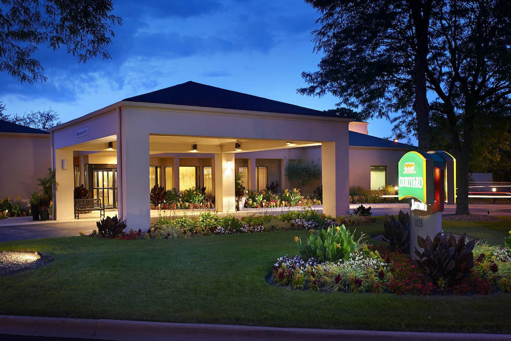 Courtyard by Marriott hotel entrance at dusk in Naperville, Illinois