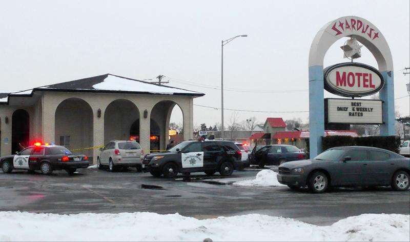 Places to Stay 5 Stardust Motel roadside sign and front office building with snow in Naperville Illinois