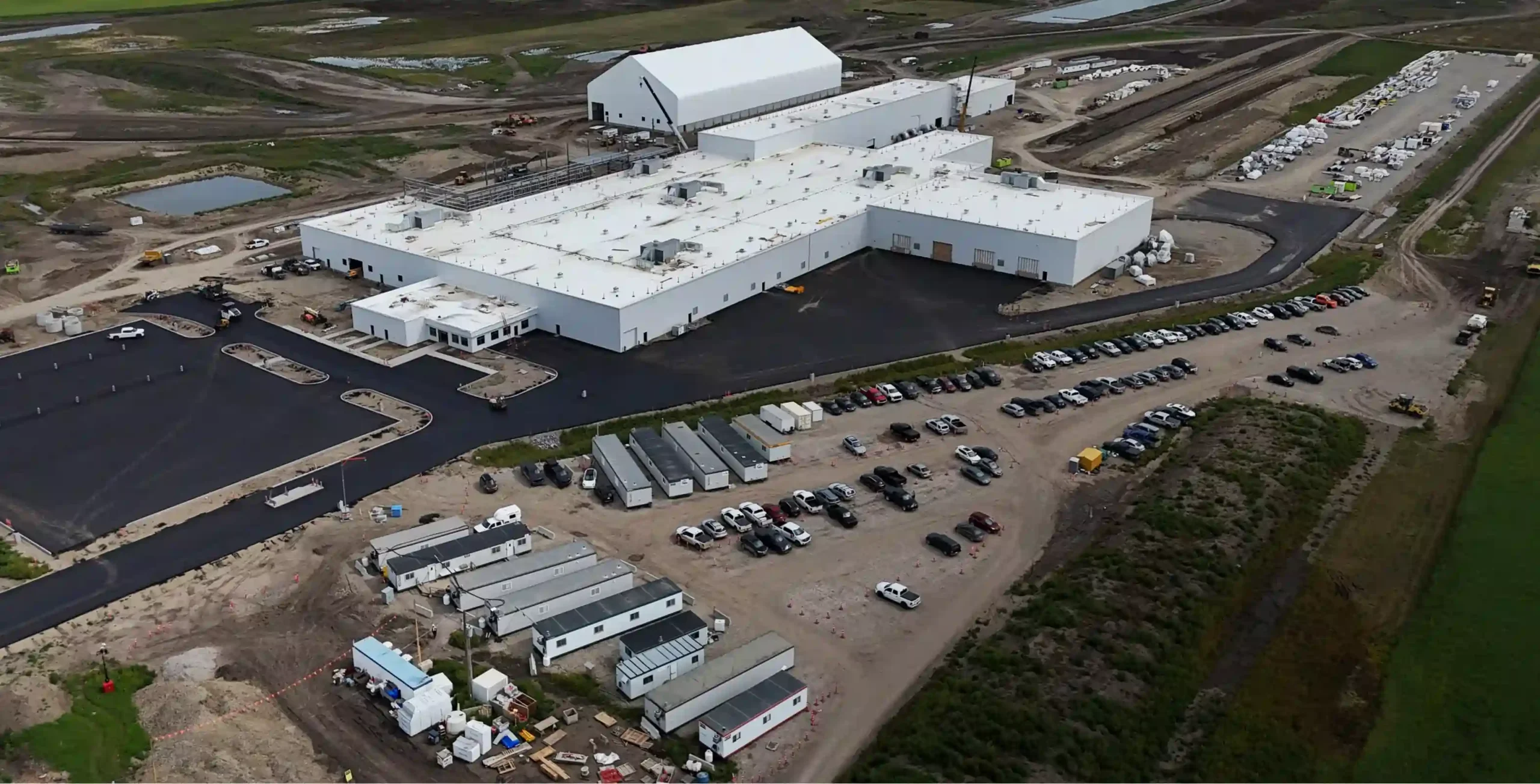 Aerial view of Wheatland Industrial Park in Naperville, Illinois with warehouse buildings and parking areas.