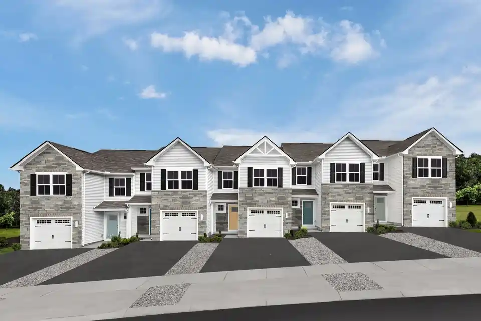Aero Estates subdivision in Naperville with newly built townhomes, attached garages, driveways, and landscaped front entries.