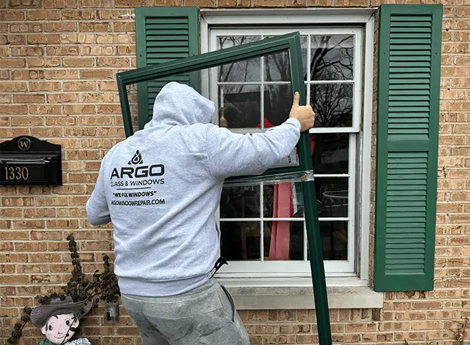 Argo Glass and Windows technician installing a residential window near Naperville Illinois