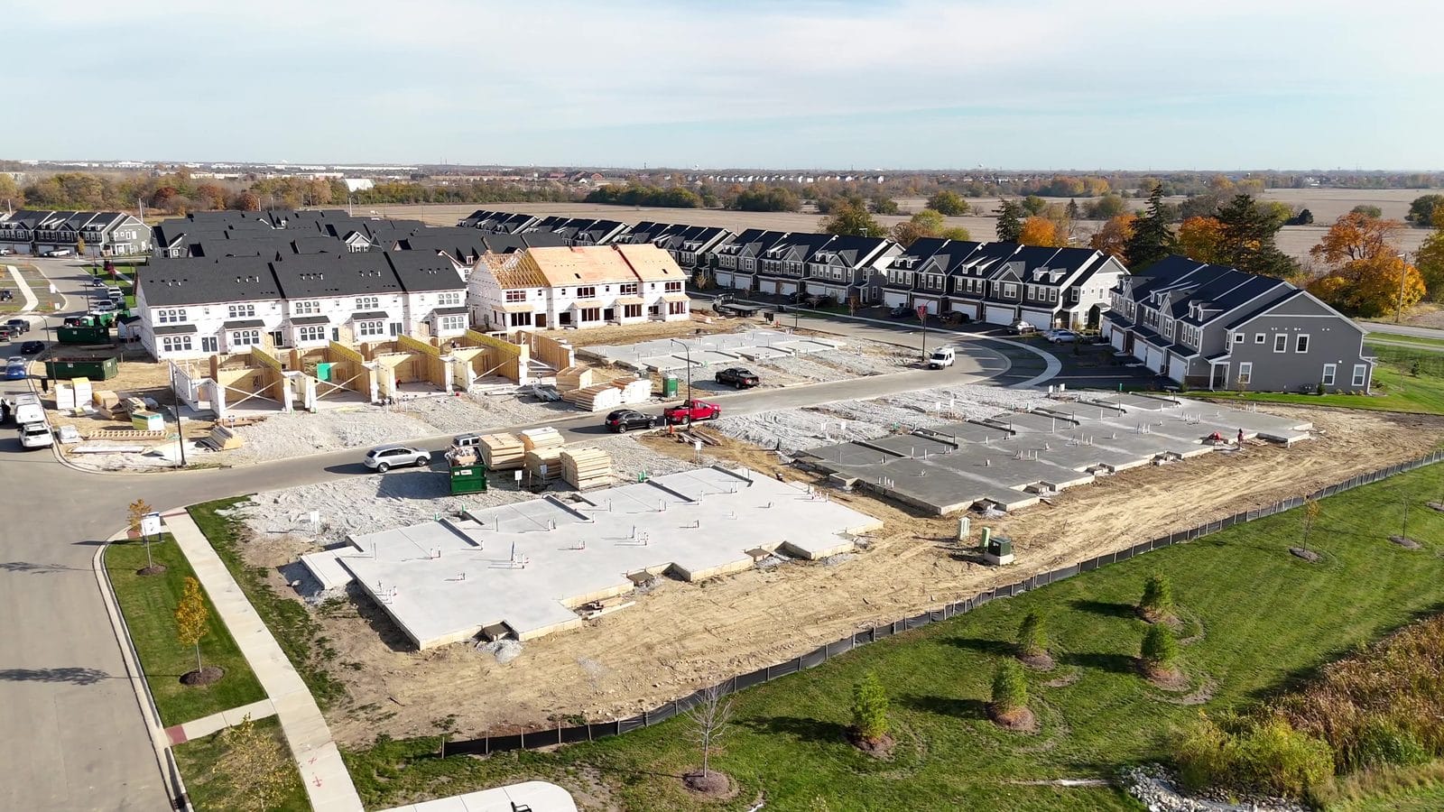 Average rent in Naperville IL: rows of attached two-story homes, some still under construction