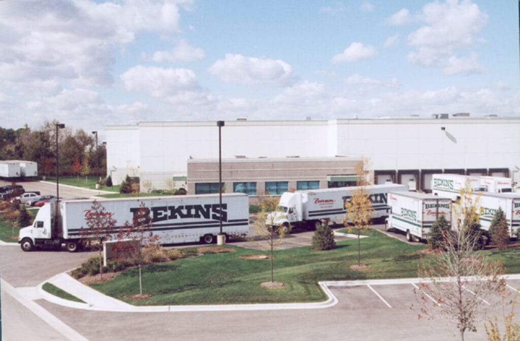 Boerman Moving and Storage Bekins moving trucks parked outside a commercial storage and moving facility serving the Naperville area.