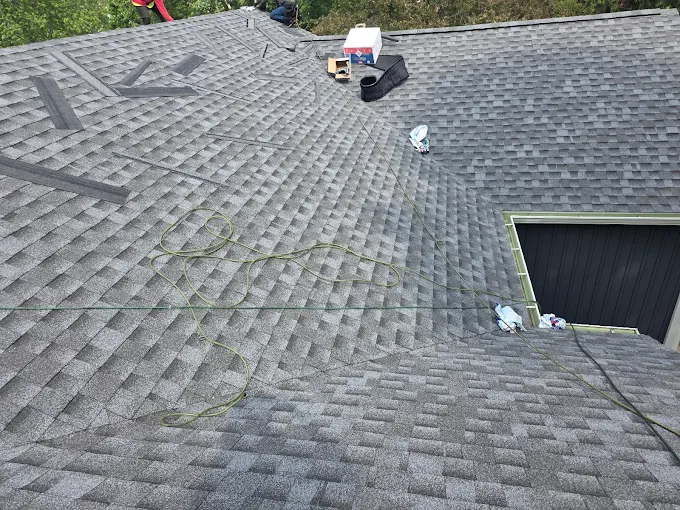 Completed asphalt shingle roof installation by Casey Roofing Contractor on a residential property in Naperville, Illinois.