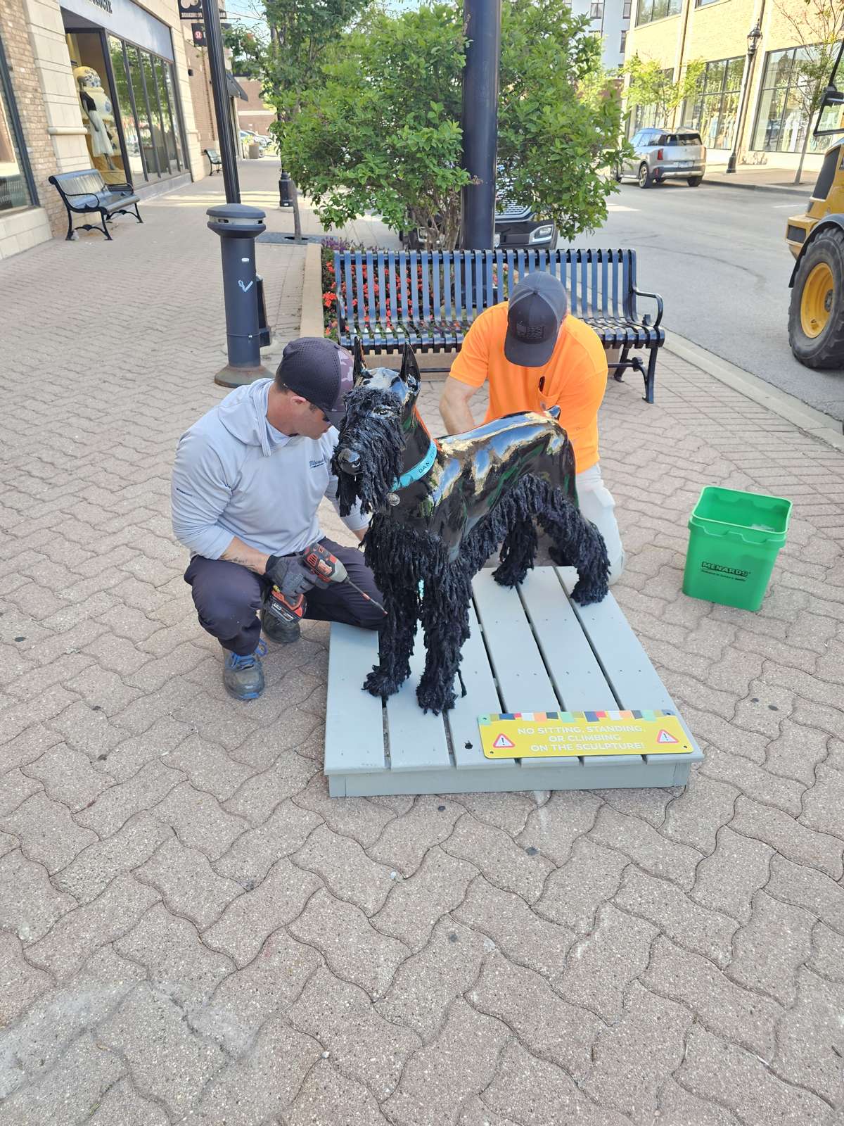Dog Days of Summer dog sculpture on a bench-lined Downtown Naperville sidewalk