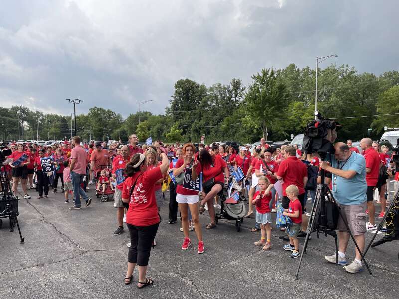 Families and parents attending and supporting a school community event in Naperville, Illinois
