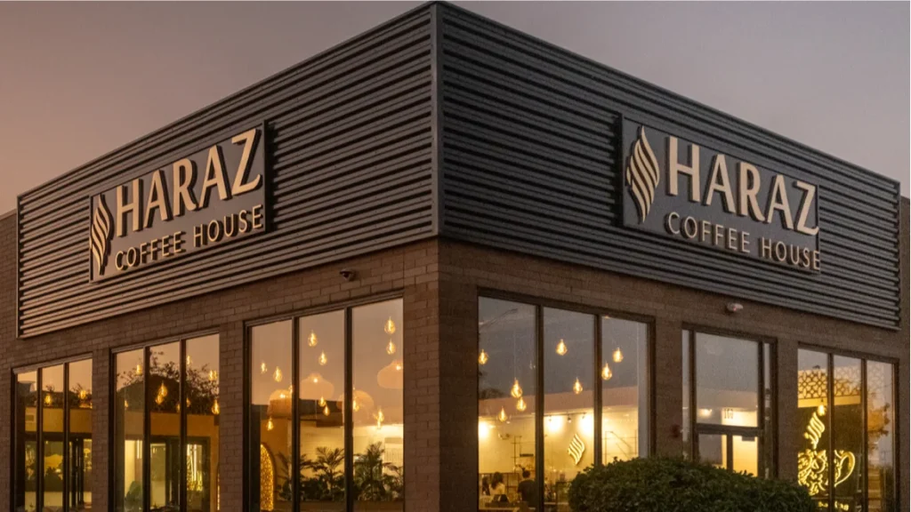 Haraz Coffee House storefront exterior at dusk on Route 59 corridor Aurora Illinois near Naperville 2026