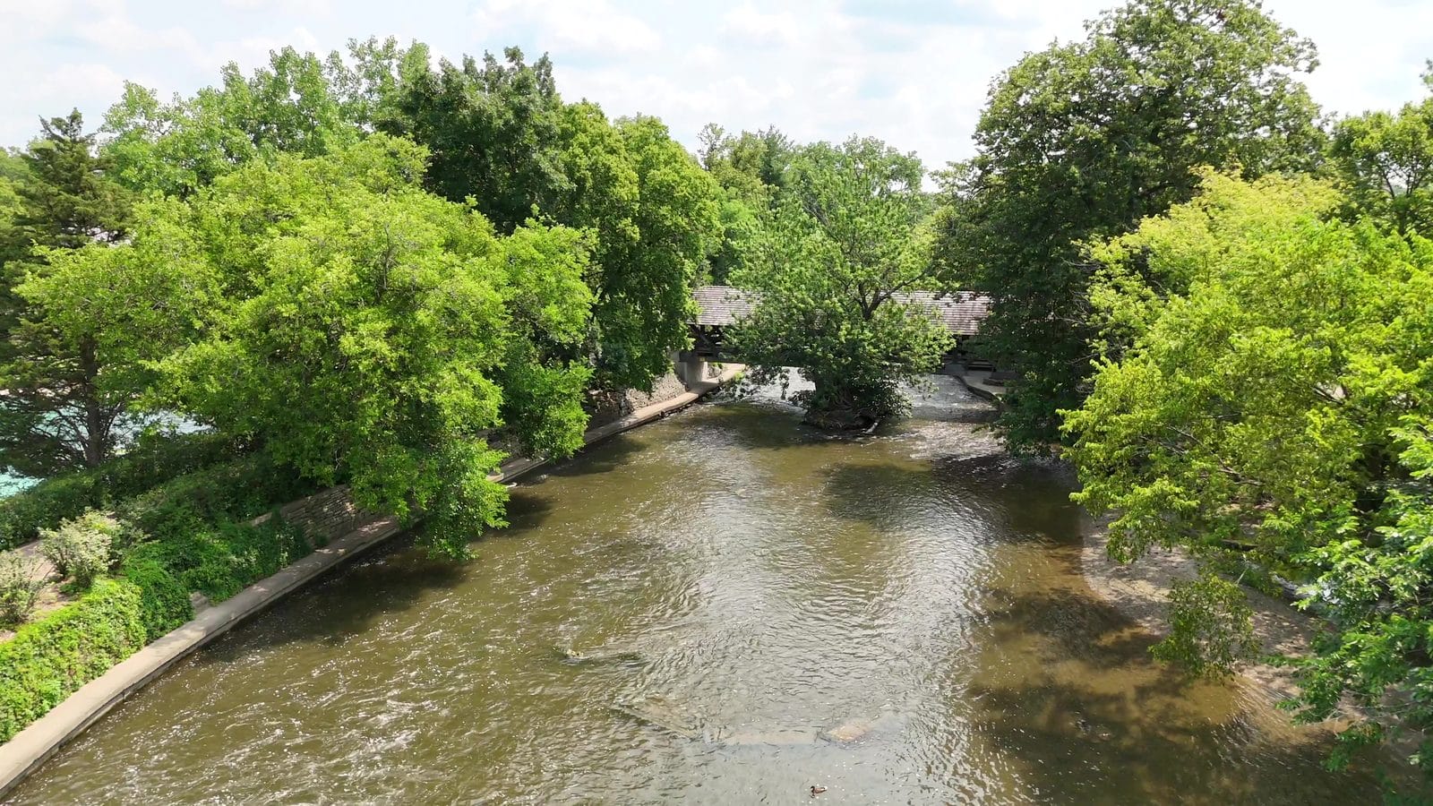 First Time Home Buyer Programs in Naperville: IHDA, Limits and Steps 3 IHDA homebuyer education timeline: summer aerial of the Naperville Riverwalk and covered bridge