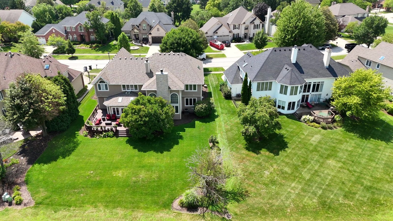 Kick out clause in Illinois: aerial of two Naperville homes with rear decks