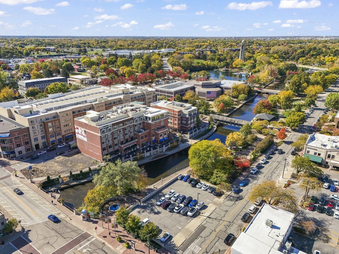 Aerial view of mid-rise, not high-rise, Water Street buildings on the Naperville Riverwalk