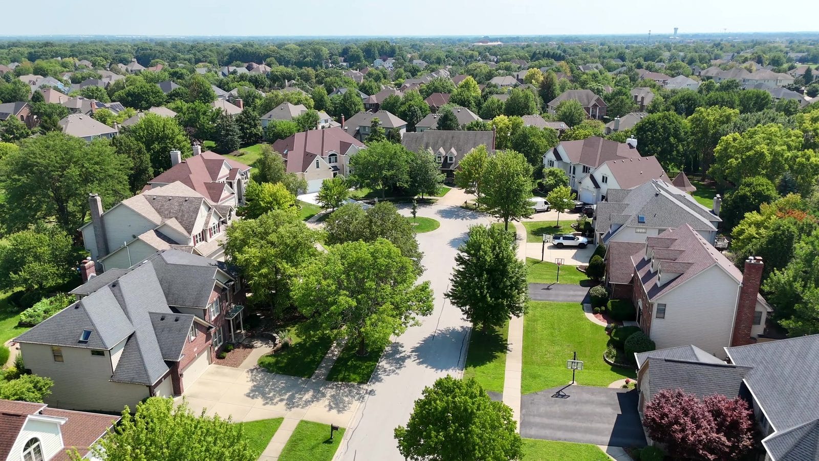 Buyer agreement before touring: aerial of two story homes on a Naperville cul de sac