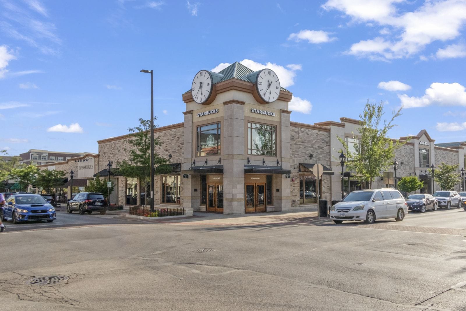 Starbucks storefront at a downtown Naperville street corner