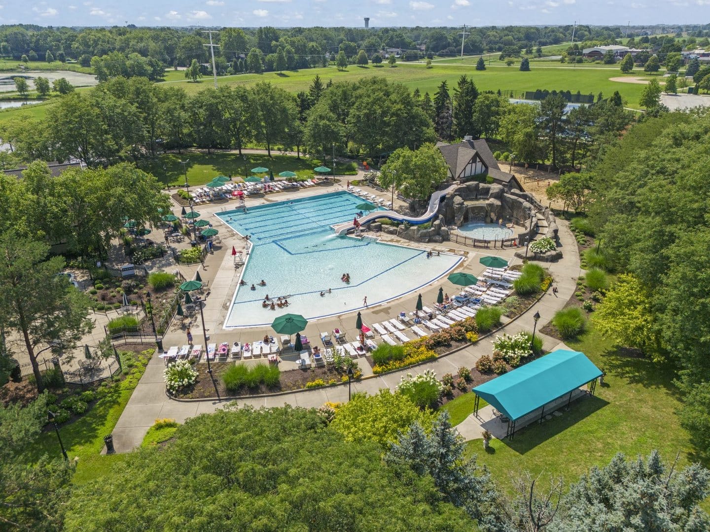Aerial view of the Ashbury Aquatic Center pool, water slide and lounge area in Naperville
