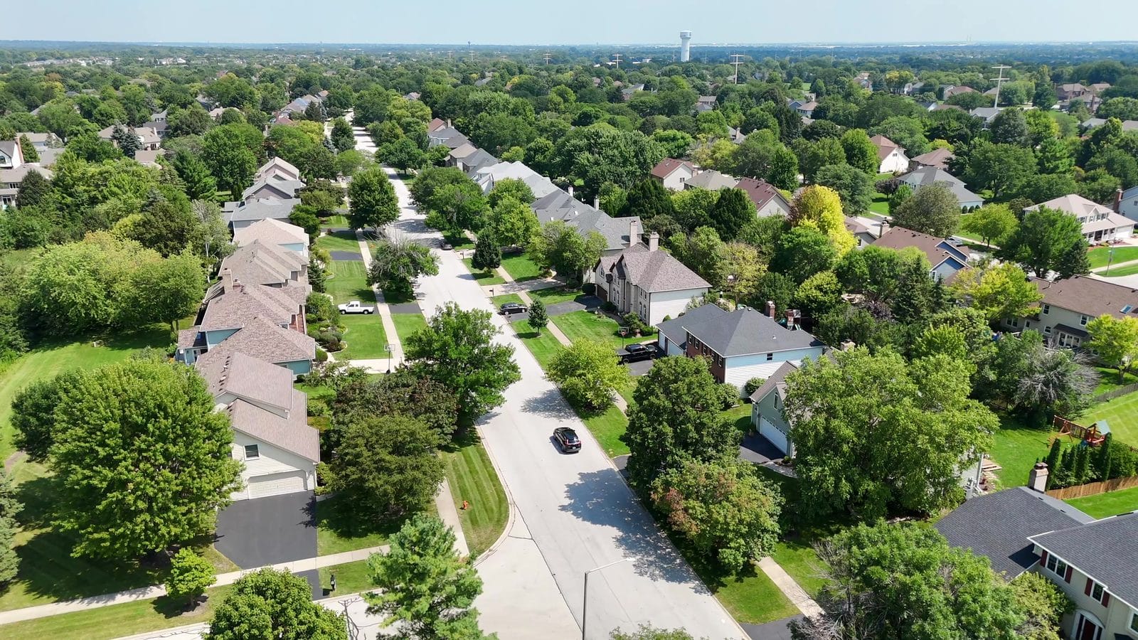 Building a Custom Home in Naperville: Lots, Teardowns, Costs, Builders 2 Cost to build a custom home in Naperville: aerial of two-story homes with attached garages