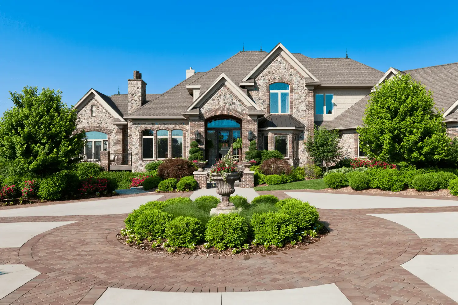 Connect 1 Luxurious Naperville dream home with elegant stone façade and manicured landscaping, representing premium real estate opportunities with Dan Firks Real Estate.