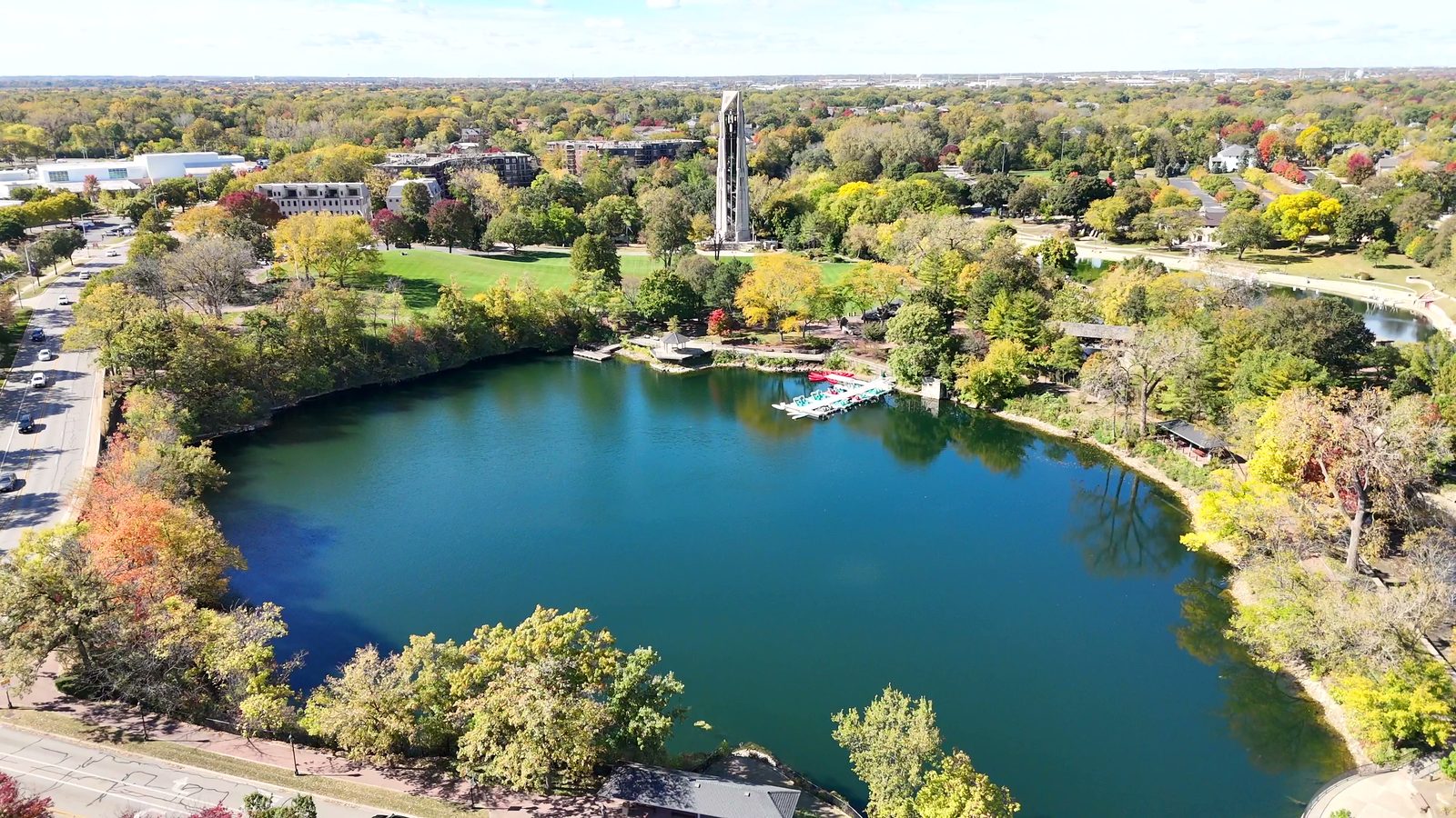 Naperville Halloween and Fall Events 2026: Things to Do Oct 10 to Nov 5 4 Quarry lake with docked paddleboats, Moser Tower and fall trees along the Naperville Riverwalk
