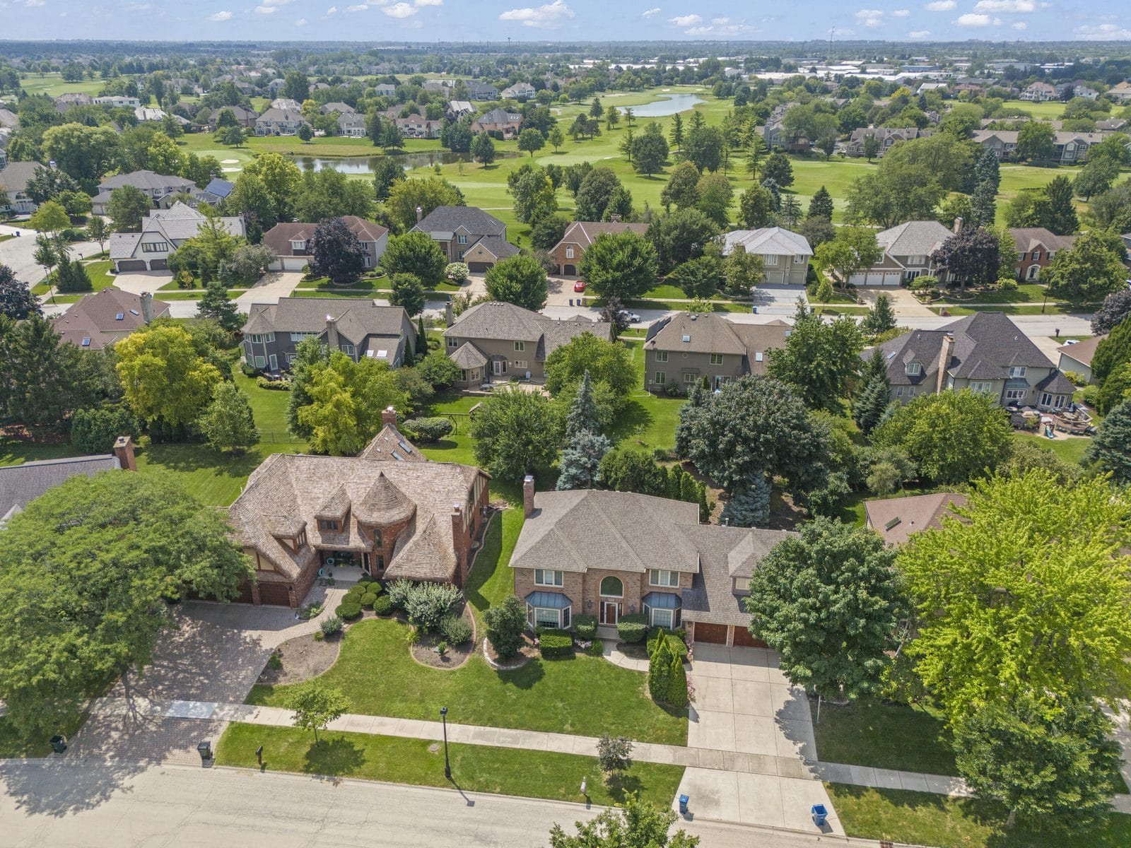 Large Naperville Family Homes Backing to a Golf Course, Aerial View Aerial view of large brick and stone Naperville family homes backing onto a golf course