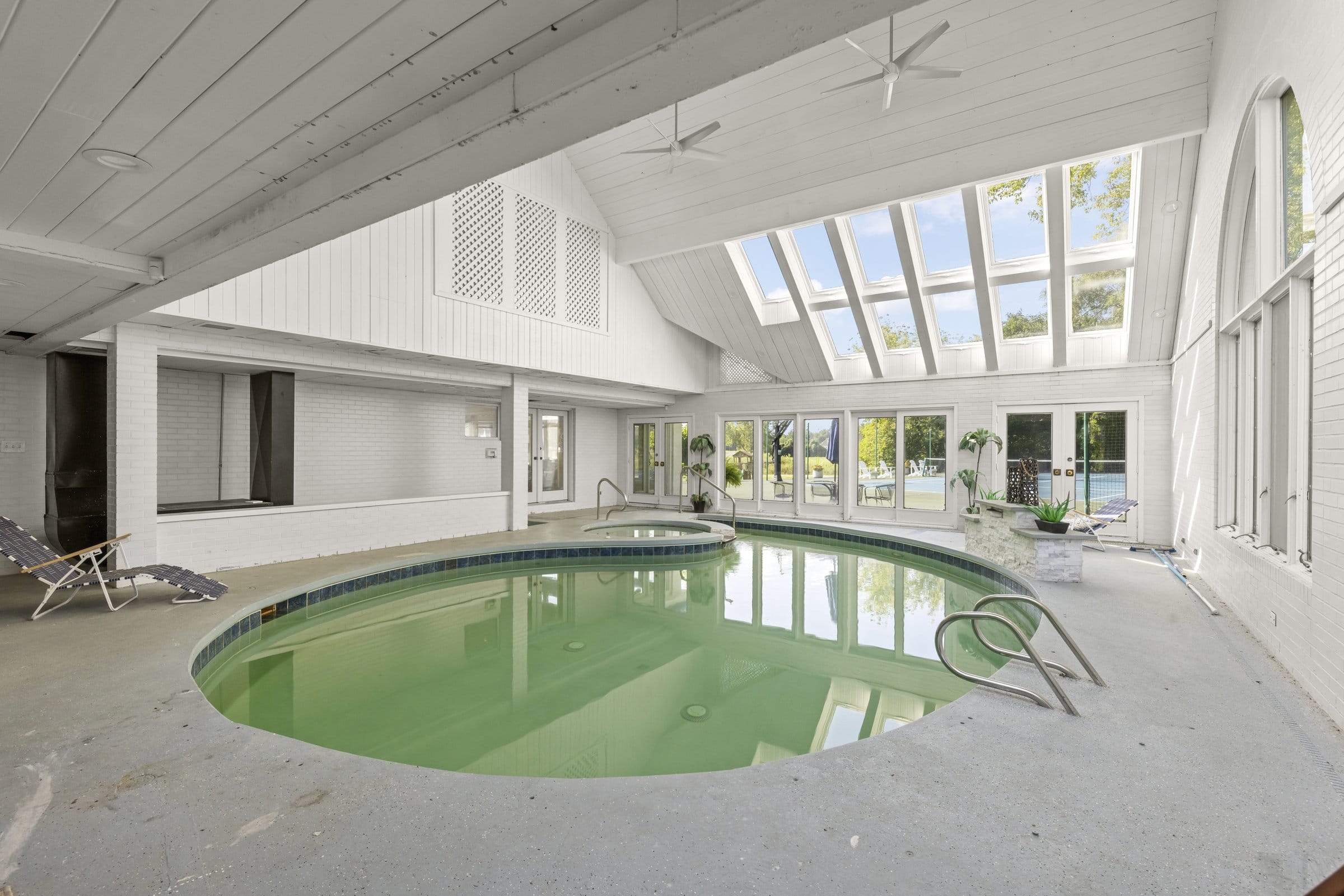 Naperville Luxury Home for Sale: 23W735 Hobson Road, a 2.65-Acre Estate with Indoor Pool and Tennis Courts 5 Heated indoor pool and whirlpool under a vaulted skylit ceiling at this Naperville luxury home