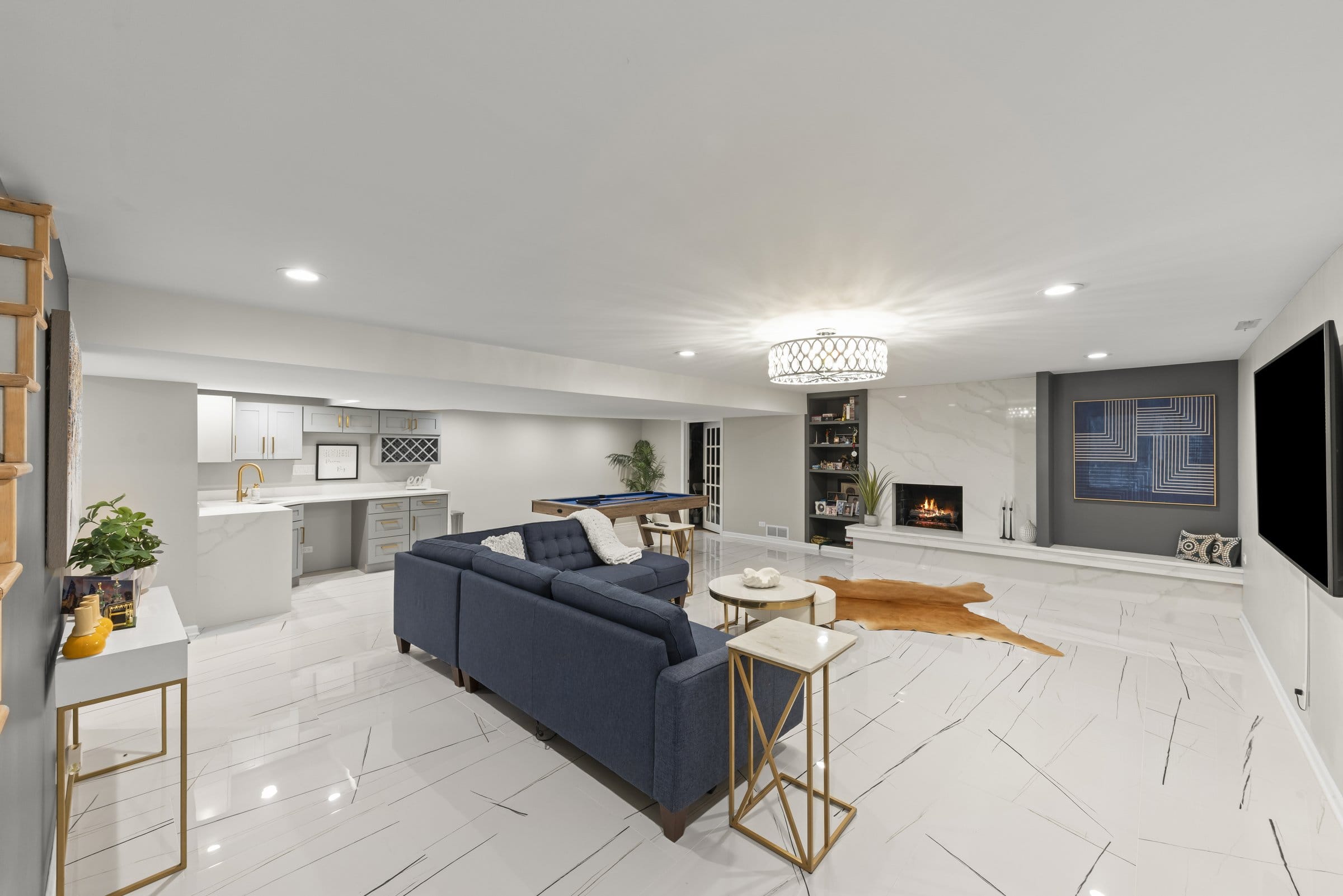 Naperville Luxury Home for Sale: 23W735 Hobson Road, a 2.65-Acre Estate with Indoor Pool and Tennis Courts 15 Lower level recreation room with fireplace, wet bar and marble look tile in Naperville estate