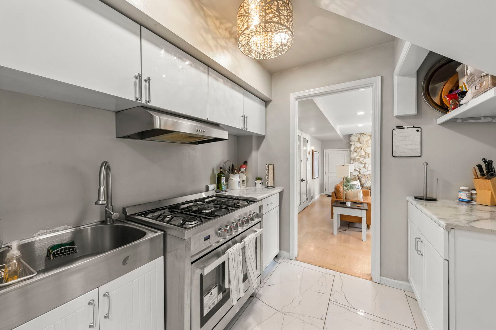 Naperville Luxury Home for Sale: 23W735 Hobson Road, a 2.65-Acre Estate with Indoor Pool and Tennis Courts 12 Second prep kitchen with professional range, hood and deep stainless sink in Naperville estate