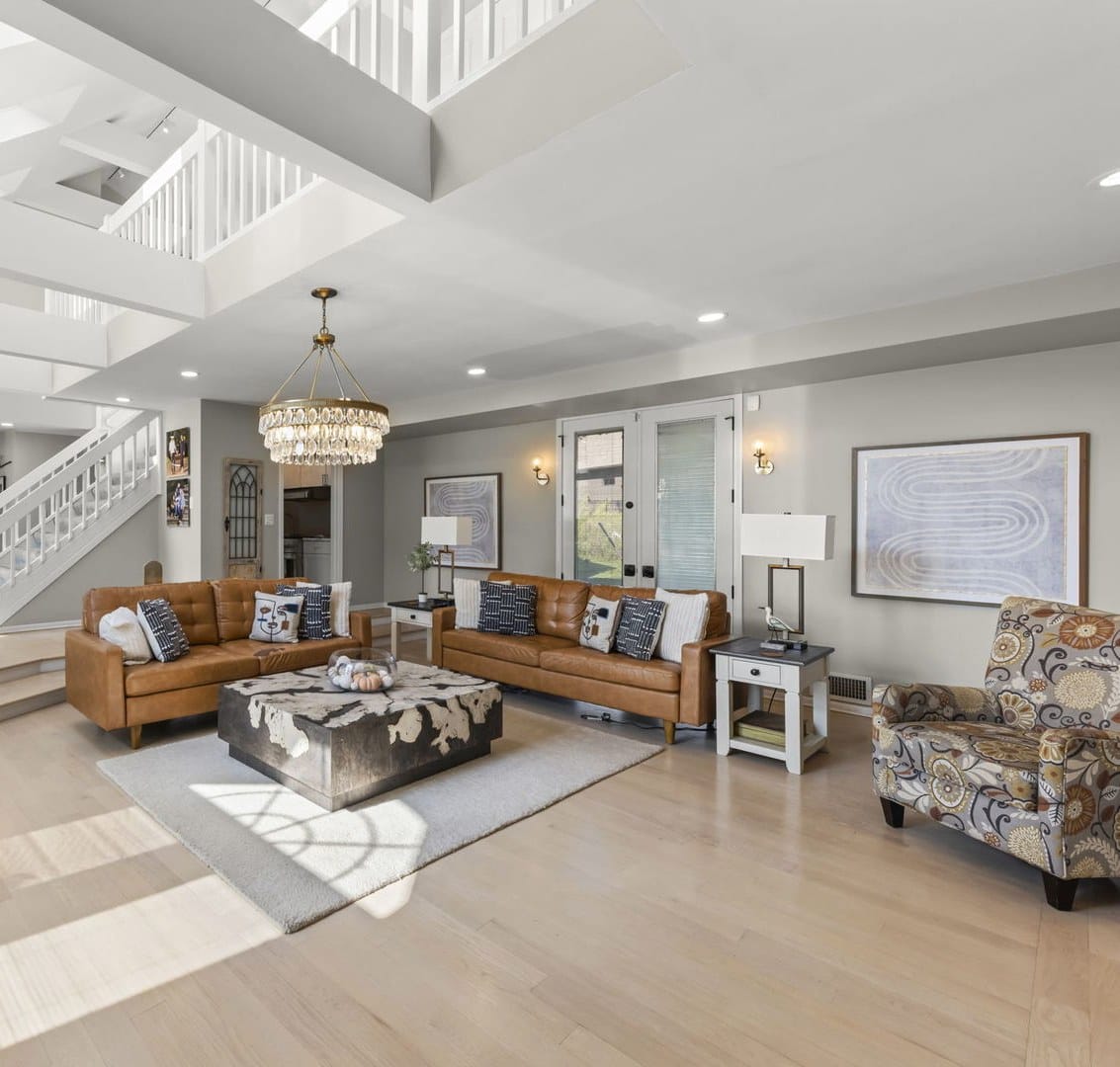Naperville Luxury Home for Sale: 23W735 Hobson Road, a 2.65-Acre Estate with Indoor Pool and Tennis Courts 9 Sunken family room with two story ceiling, chandelier and open staircase in Naperville