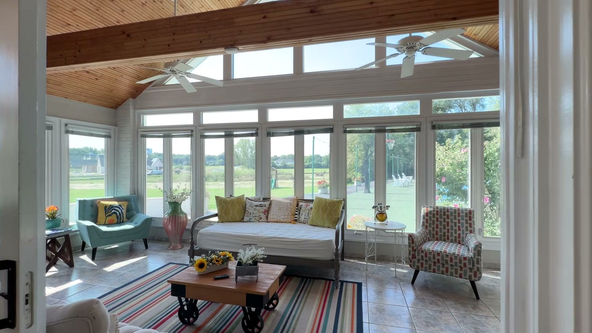 Naperville Luxury Home for Sale: 23W735 Hobson Road, a 2.65-Acre Estate with Indoor Pool and Tennis Courts 10 Vaulted sunroom with wood ceiling and wraparound windows overlooking the Naperville estate lawn