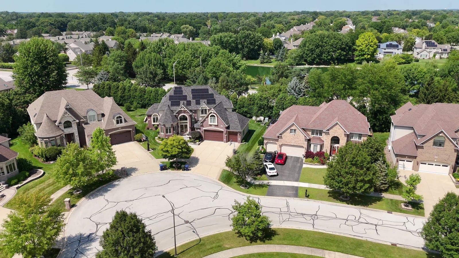 Ranch Homes in Naperville: How to Search, Verify and Inspect 3 Ranch home inspection in Naperville: close drone view of shingled roofs on two-story homes