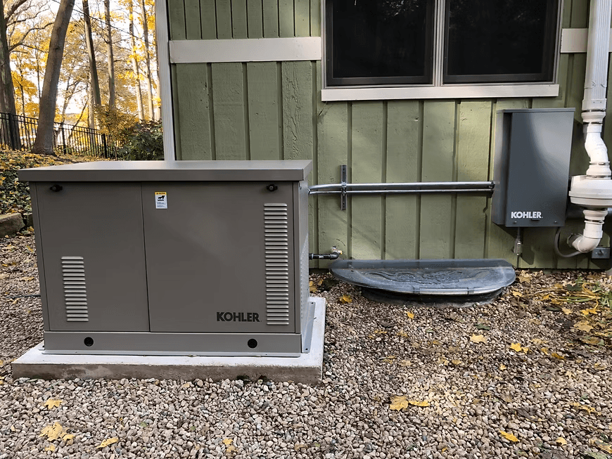 Kohler standby generator installed beside a home for electrical backup power and generator service in the Naperville area.