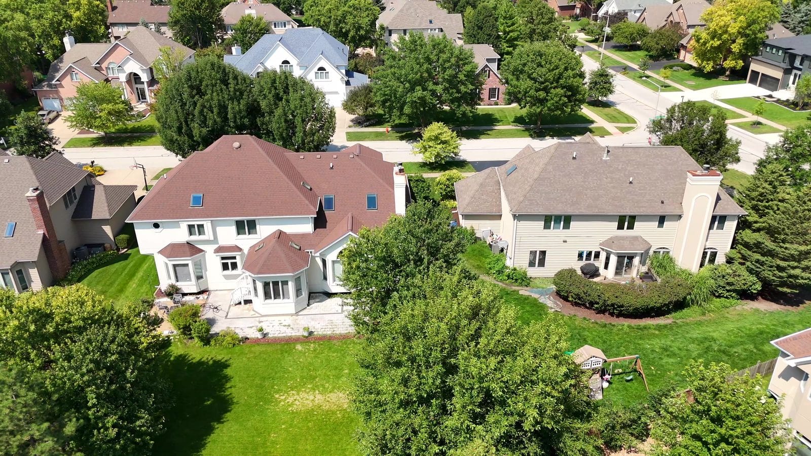 Buying a Foreclosure or Short Sale in Naperville: How Each One Works 2 Buying a short sale in Illinois: aerial of two Naperville homes and backyards