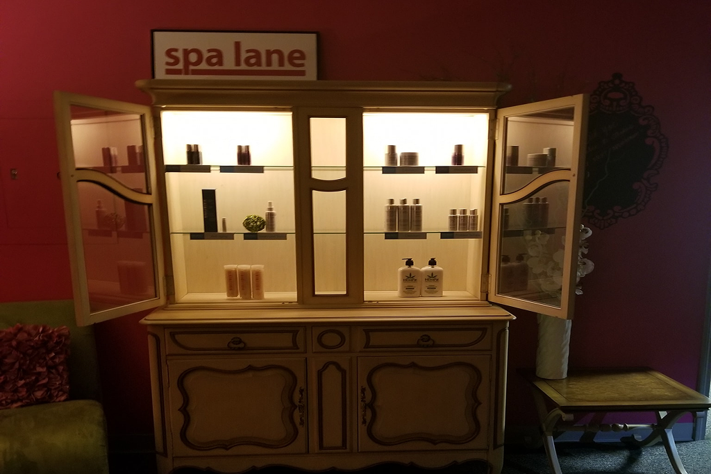 Warm interior ambiance and skincare product display at Spa Lane in downtown Naperville Illinois 2026