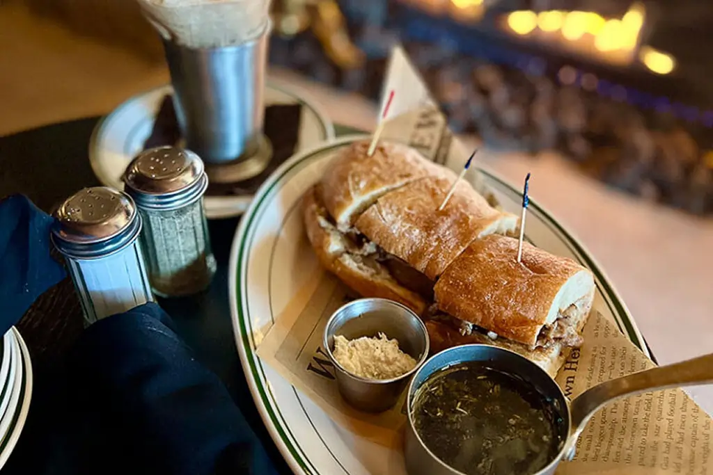 The George Dip prime rib French dip sandwich with au jus at The George Naperville 2026