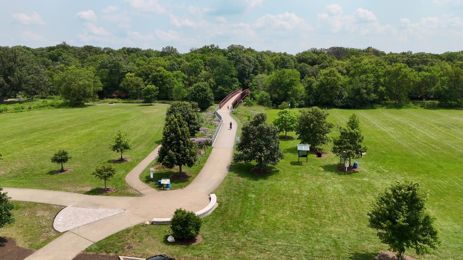 Buying a Home in Unincorporated Naperville: Outside the City Limits 2 Park District access from unincorporated Naperville: aerial of a park trail and footbridge