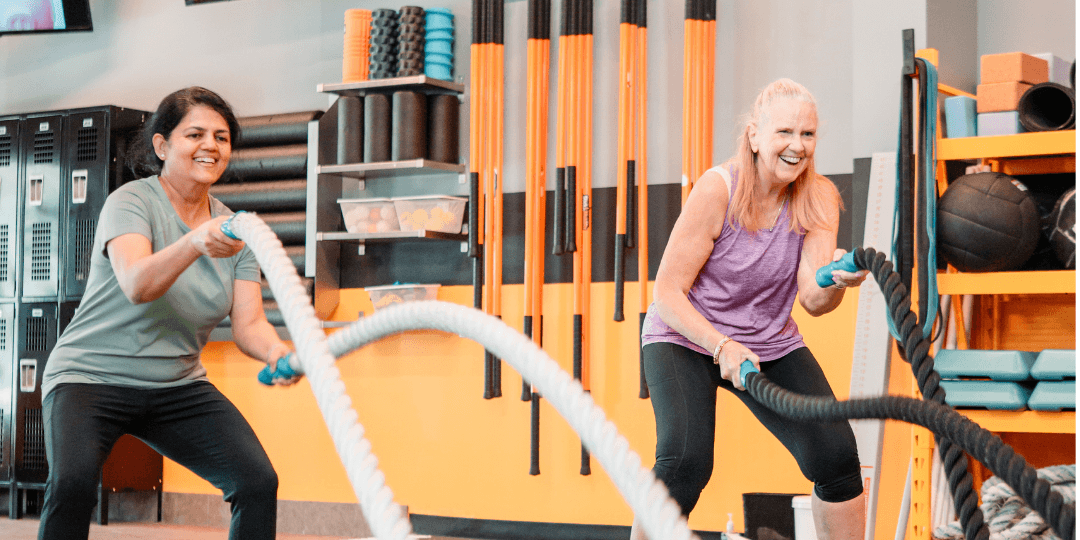 Clients participating in a battle rope strength and conditioning workout at Beyond Measure Fitness Training in Naperville, Illinois.