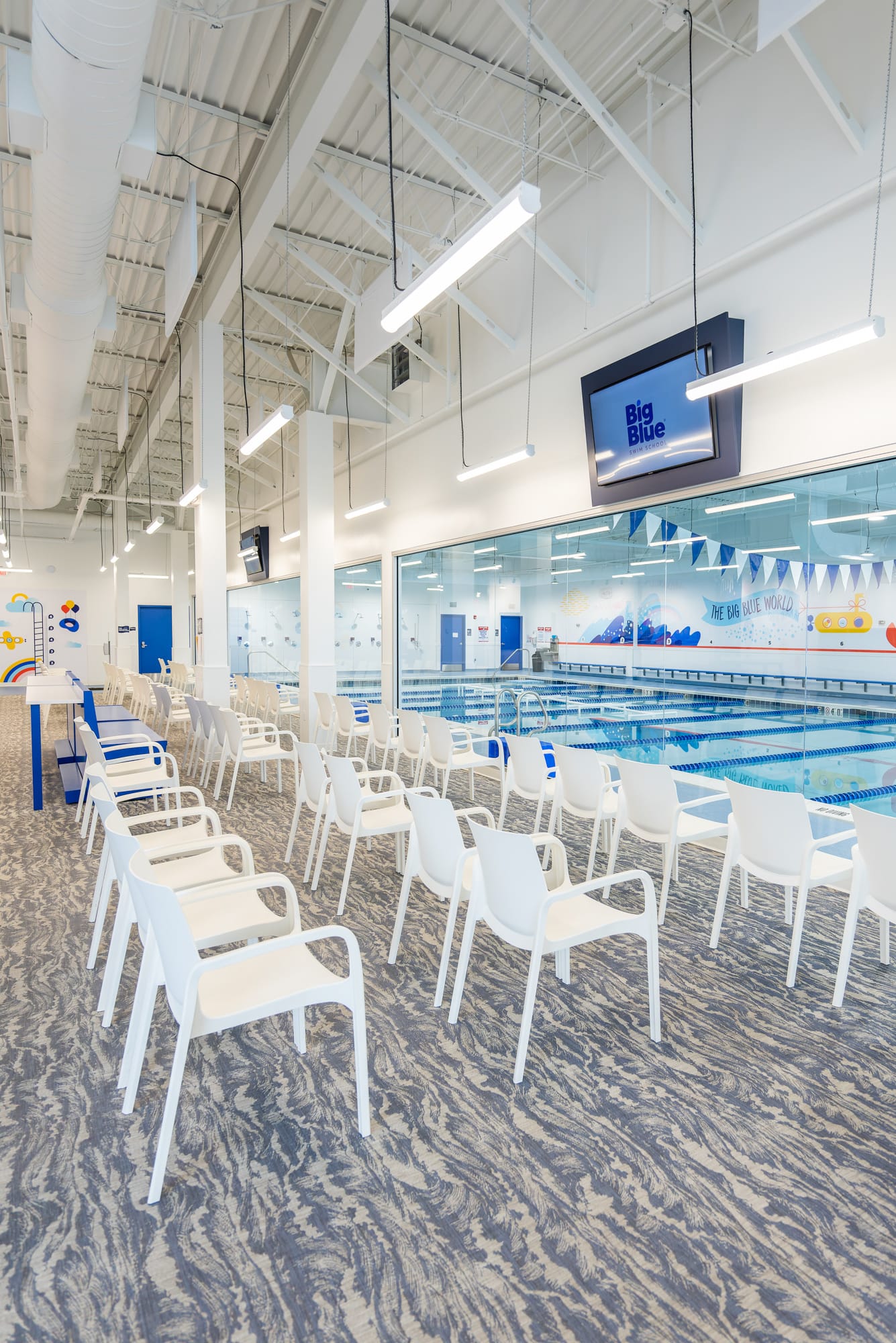 Parent viewing area overlooking the indoor swimming pool at Big Blue Swim School in Naperville, Illinois.