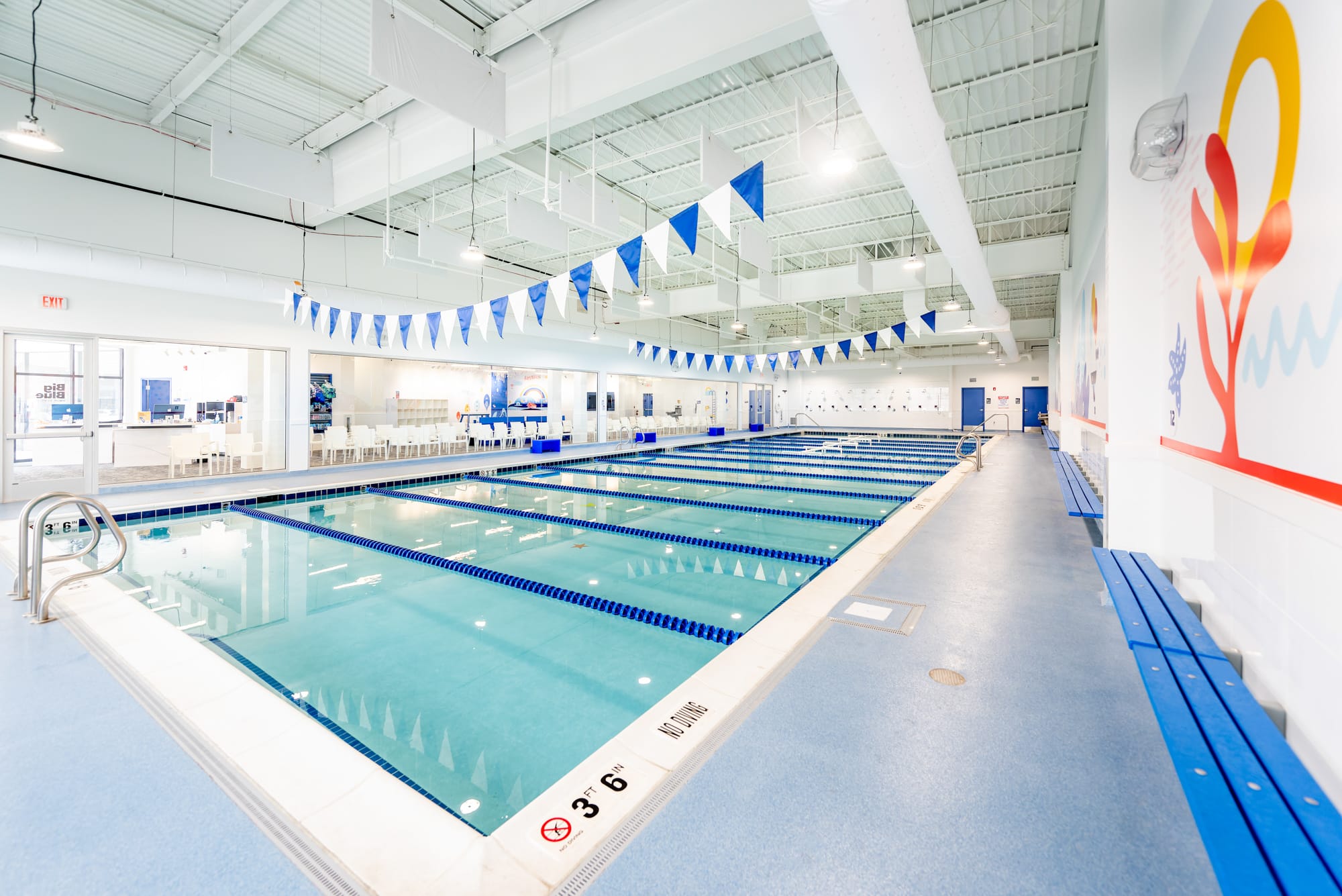 Indoor heated swimming pool with multiple swim lanes at Big Blue Swim School in Naperville, Illinois.