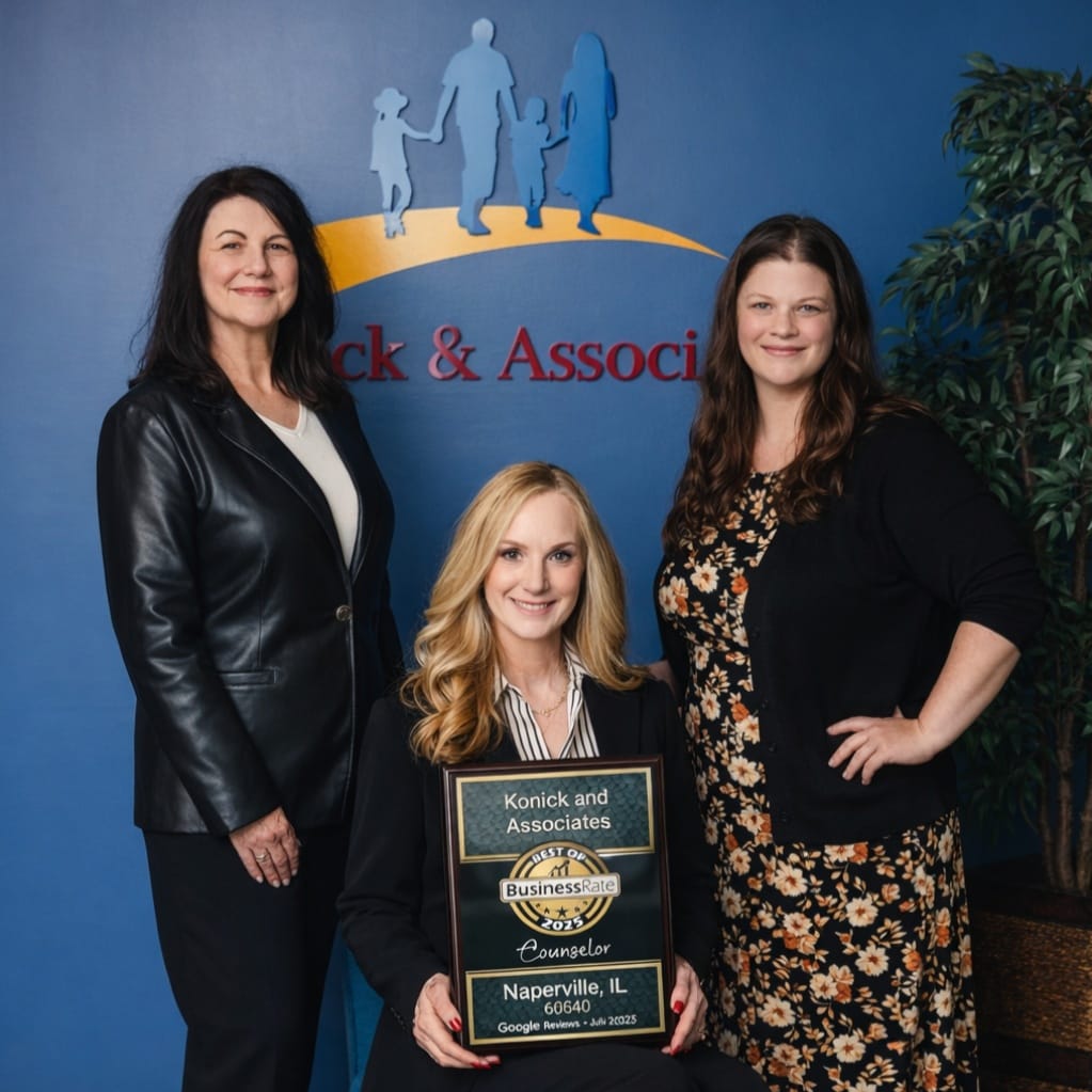 Team members of Konick and Associates financial planning firm in Naperville, Illinois recognized with a business excellence award.