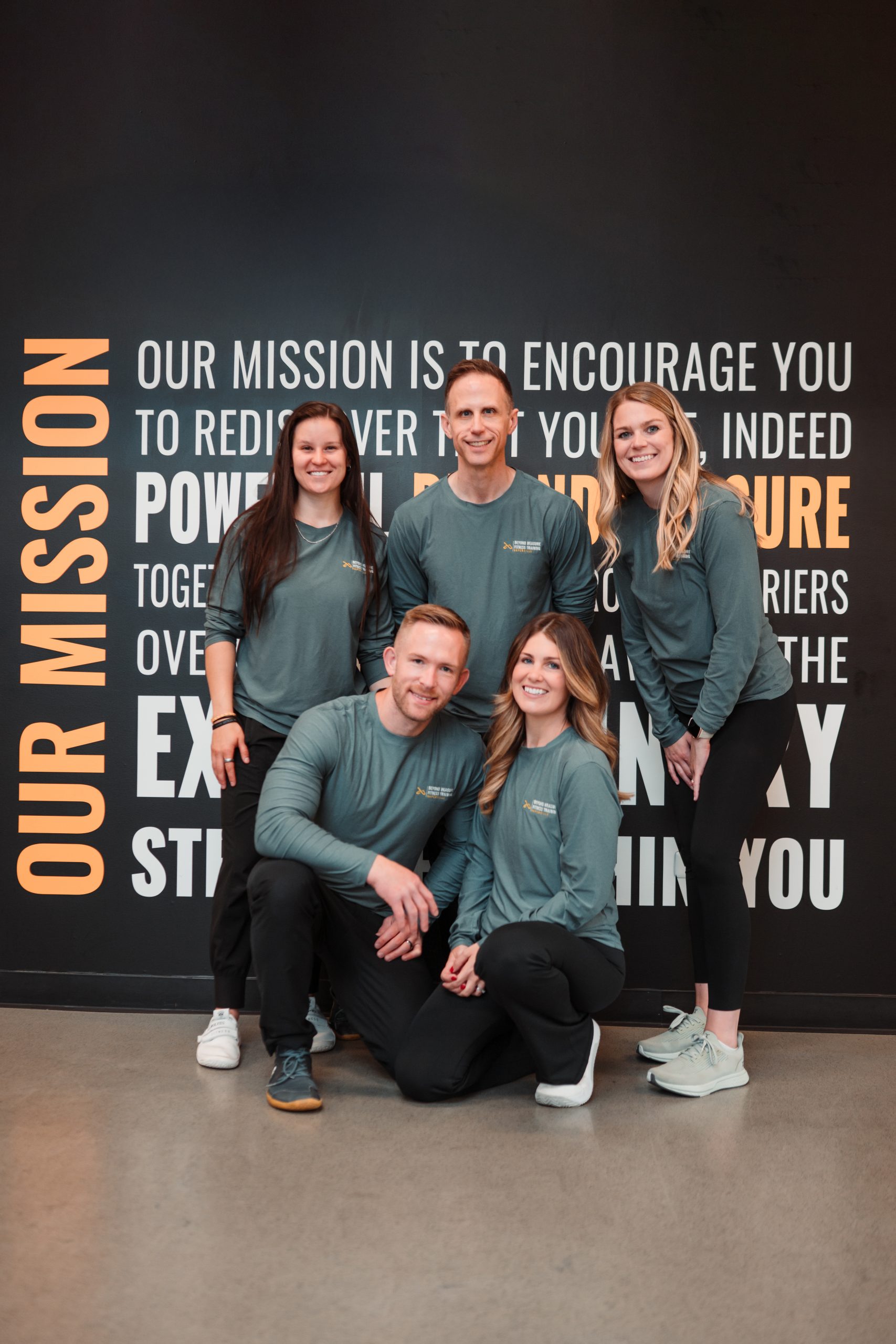 The Beyond Measure Fitness Training team posing inside their Naperville fitness facility.